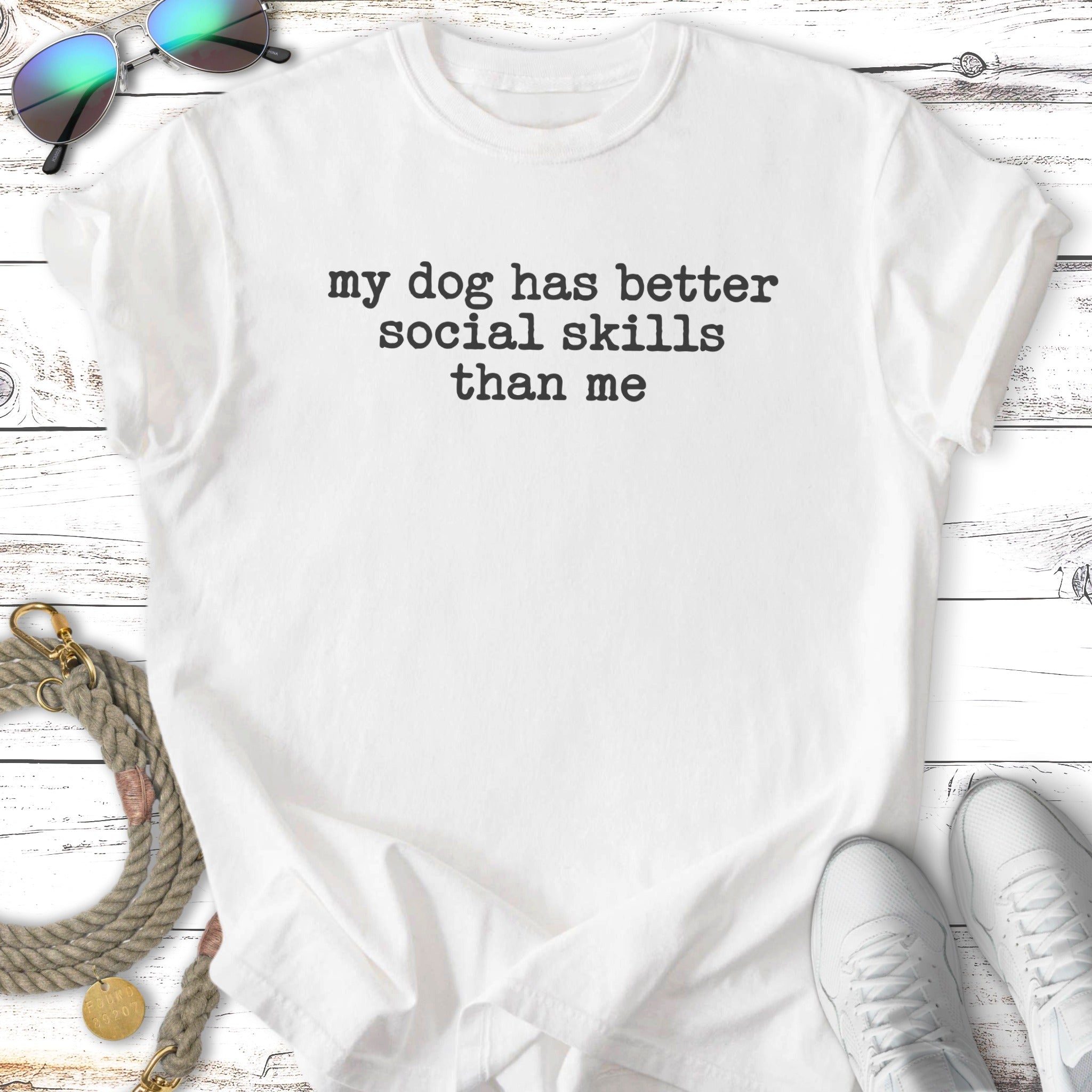 White t-shirt with "my dog has better social skills than me" text.