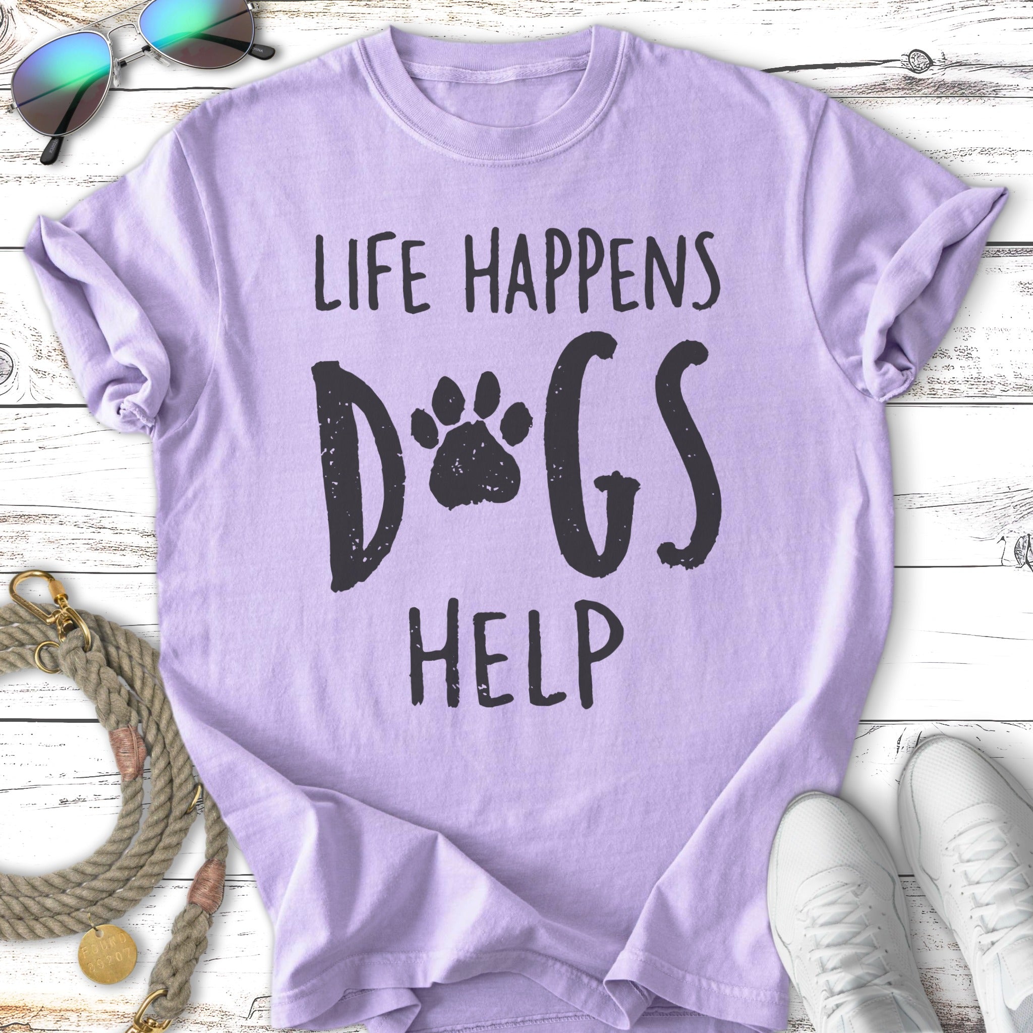 Lilac t-shirt with "Life Happens Dogs Help" and paw print graphic.