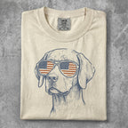 T-shirt with sketch of dog wearing American flag sunglasses.