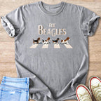 The Beagles text above four beagles walking across a crosswalk on a t-shirt.