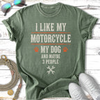 Green t-shirt with "I like my motorcycle, my dog and maybe 3 people" text.