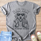 Golden retriever wearing sunglasses holding soda and fries, text says "Dad Tax"