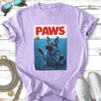 German Shepherd puppy swimming in water, reaching for a ball, with "PAWS" text.