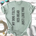 Green t-shirt with text "MY DOG TILTS HIS HEAD JUST LIKE YOU".