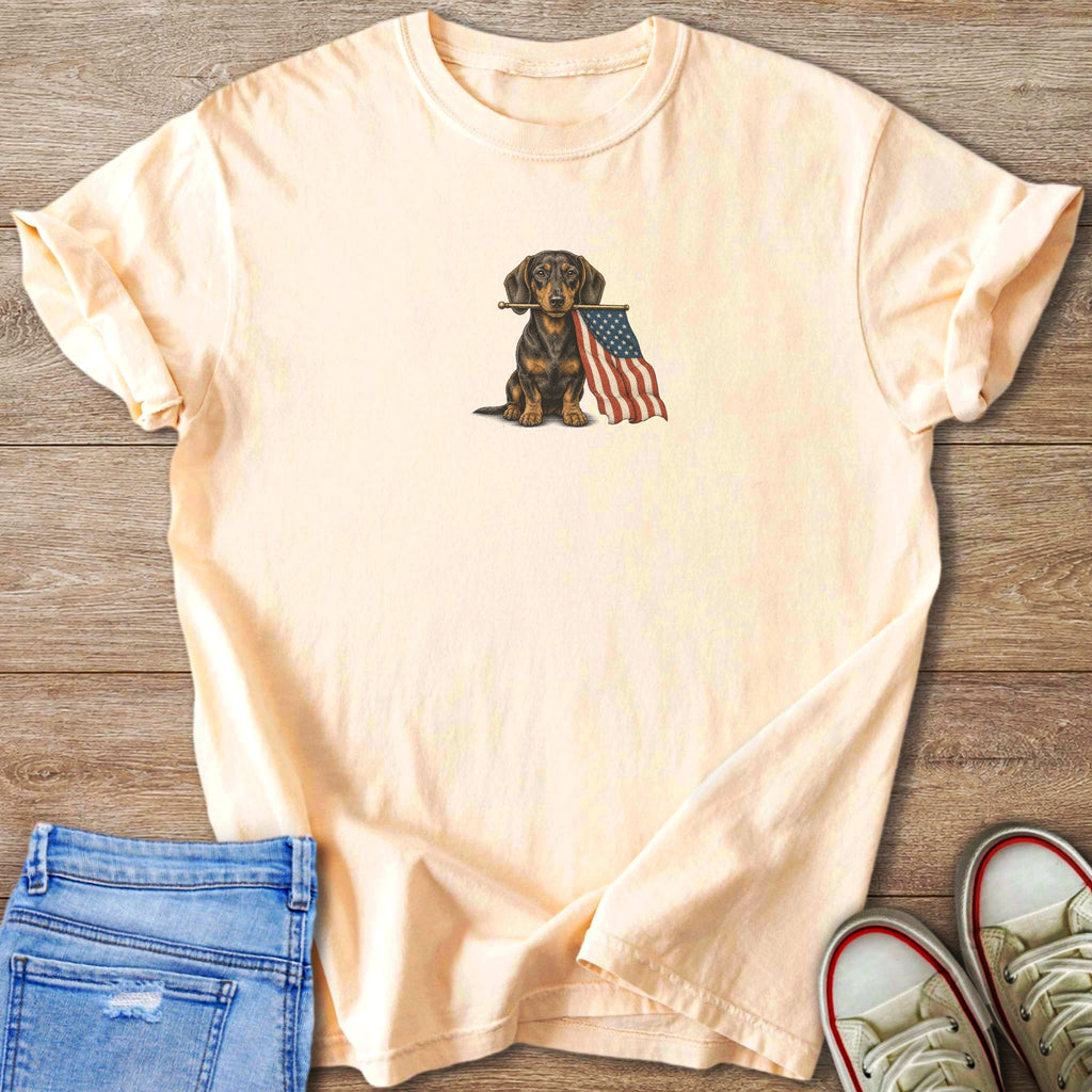 Peach t-shirt with dachshund holding American flag graphic