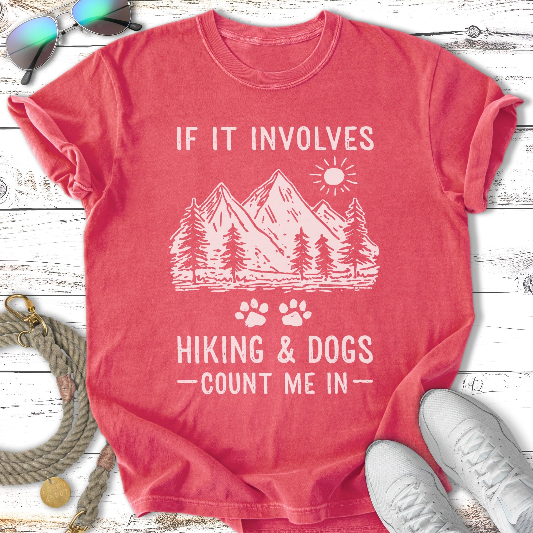 Red t-shirt with "If It Involves Hiking & Dogs - Count Me In" text and mountain graphic.