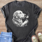 Dark gray t-shirt with a white sketch of a Golden Retriever blowing on a dandelion.