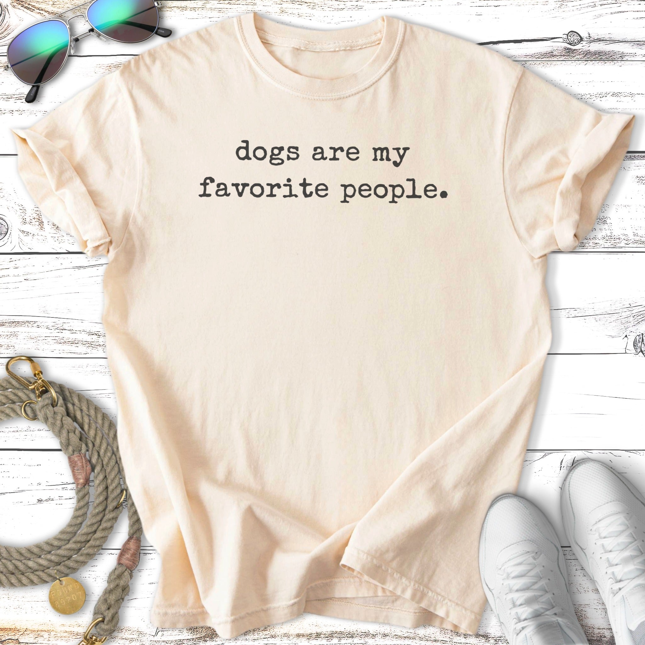 Cream t-shirt with black text reading "dogs are my favorite people."