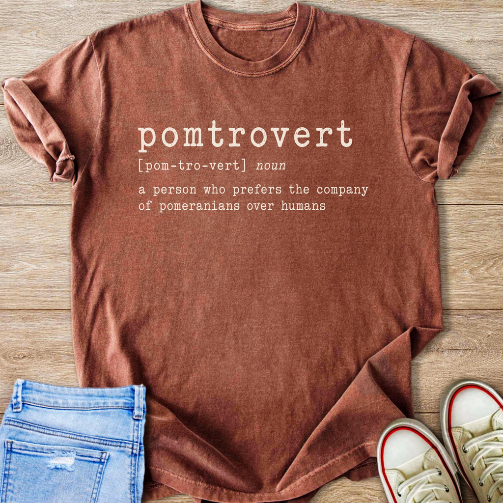 Brown t-shirt with "pomtrovert: a person who prefers the company of pomeranians over humans" text.