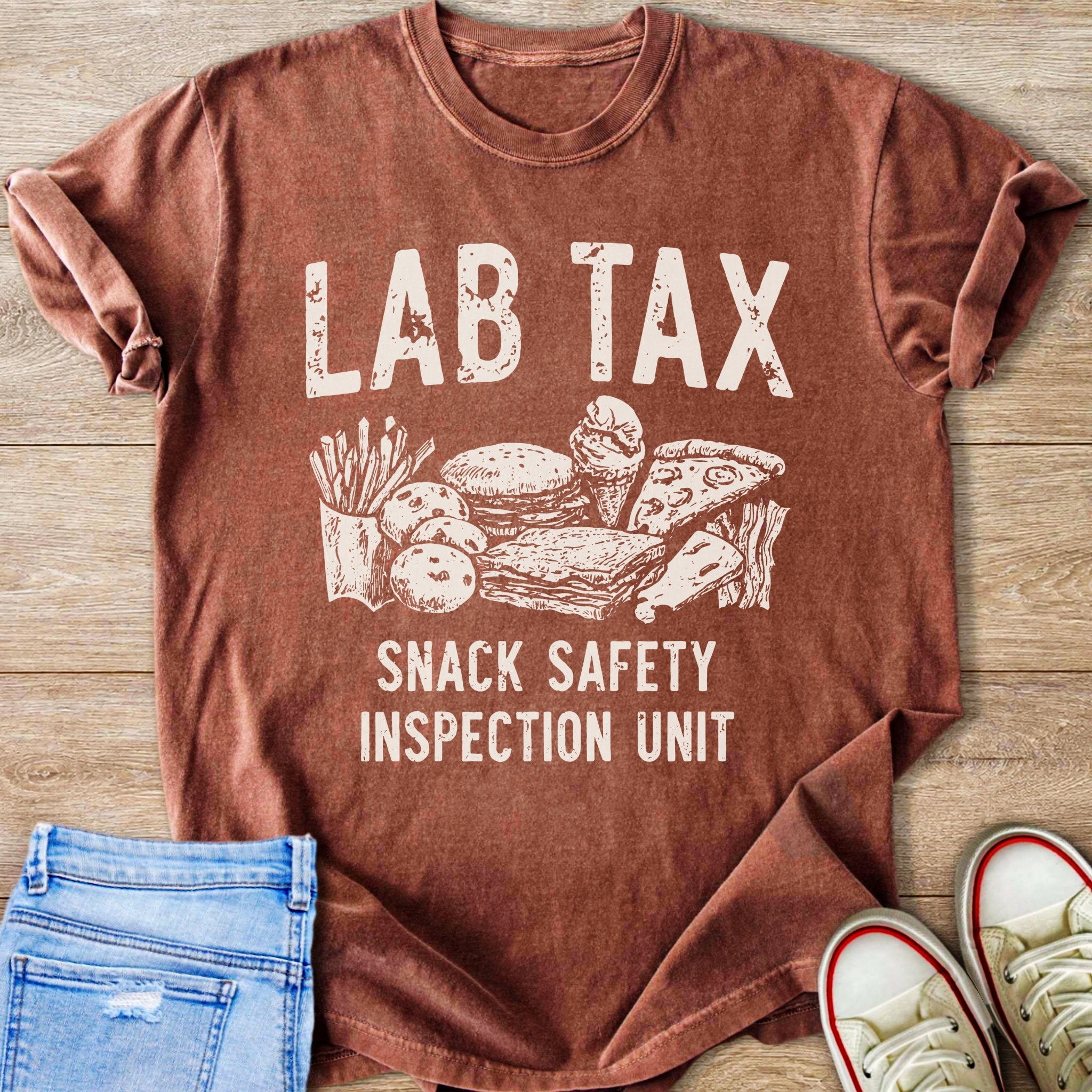 T-shirt with "LAB TAX SNACK SAFETY INSPECTION UNIT" and snack illustration.
