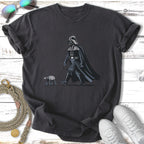 Darth Vader walks an AT-AT on a leash, shown on a dark t-shirt.