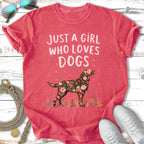Coral t-shirt with "Just a girl who loves dogs" and floral dog silhouette.