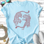 Two stylized leopards in a circular yin-yang design on a light blue t-shirt.