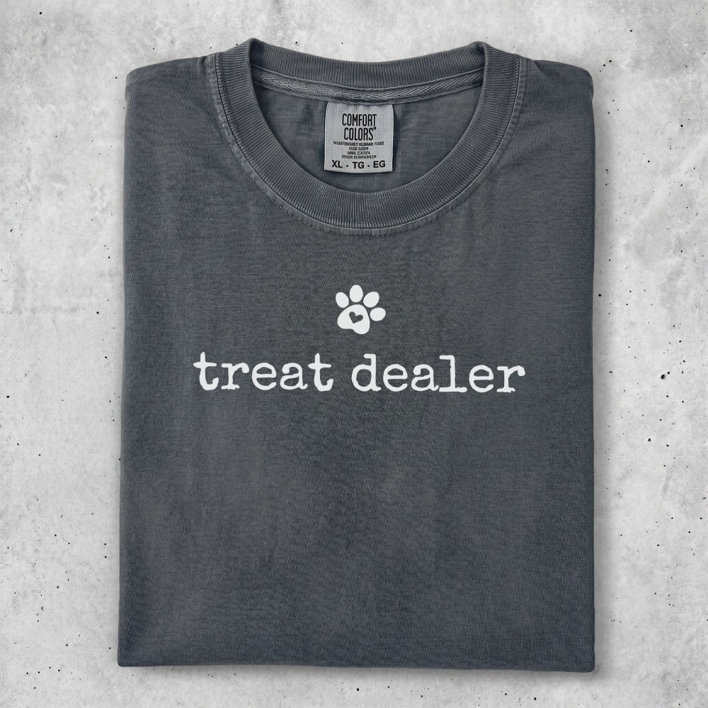 Gray t-shirt with "treat dealer" and a paw print graphic.
