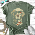 Golden Retriever dog wearing sunglasses and bandana, printed on a green t-shirt.
