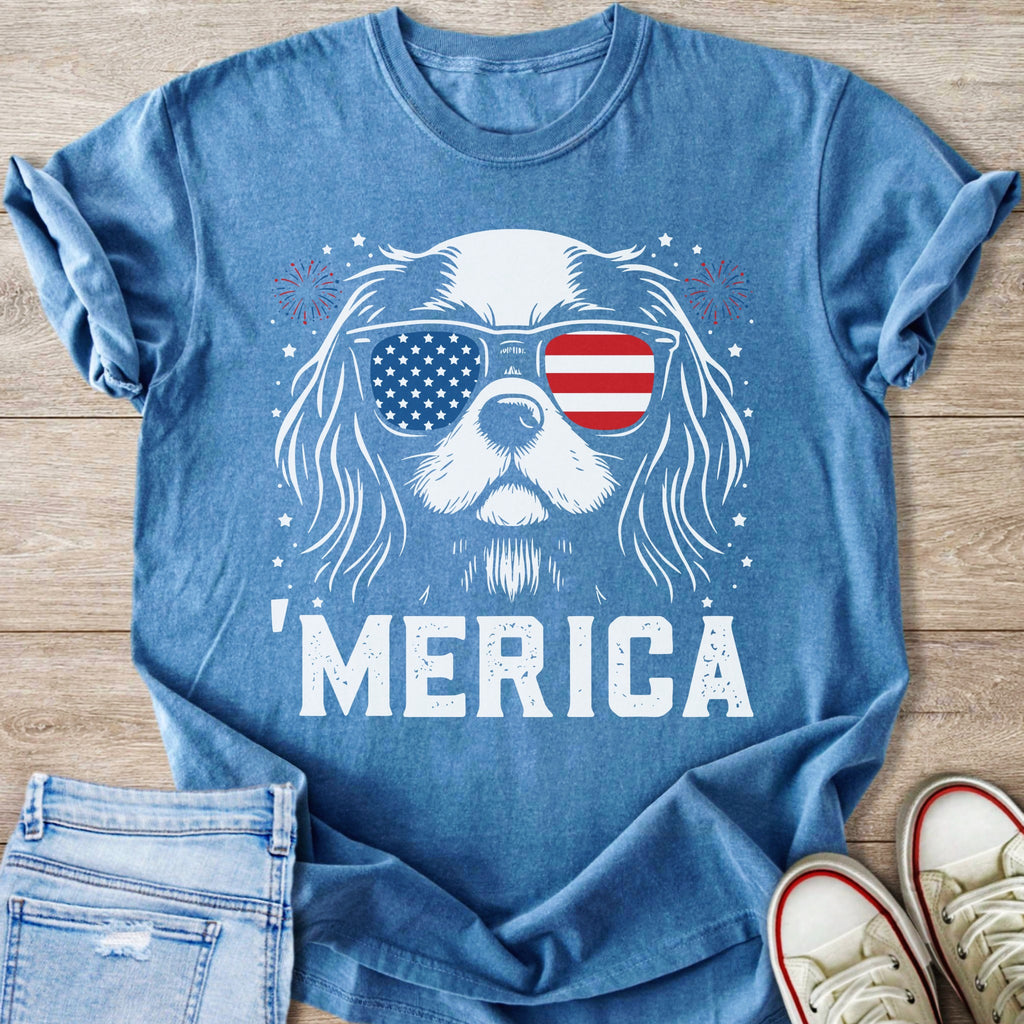 Blue t-shirt with white dog wearing American flag sunglasses and text "'MERICA".