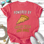 Red t-shirt with "POWERED BY CHEESE PIZZA AND DOGS" text and pizza slice graphic.
