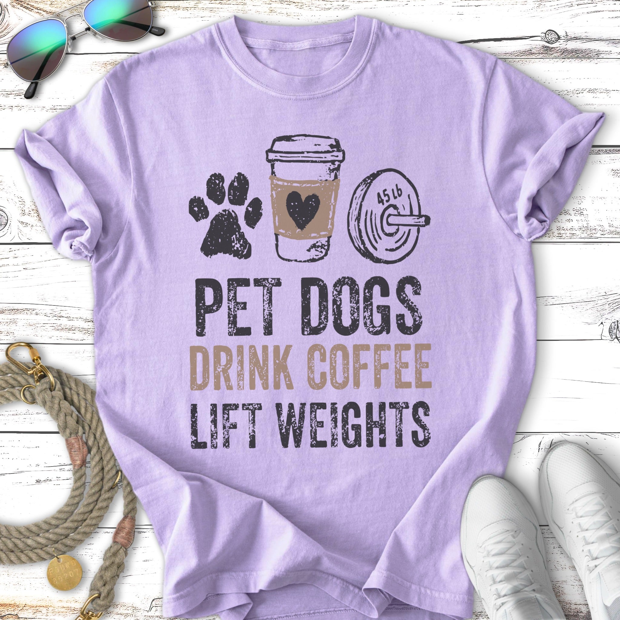 T-shirt with "PET DOGS DRINK COFFEE LIFT WEIGHTS" text and graphics.