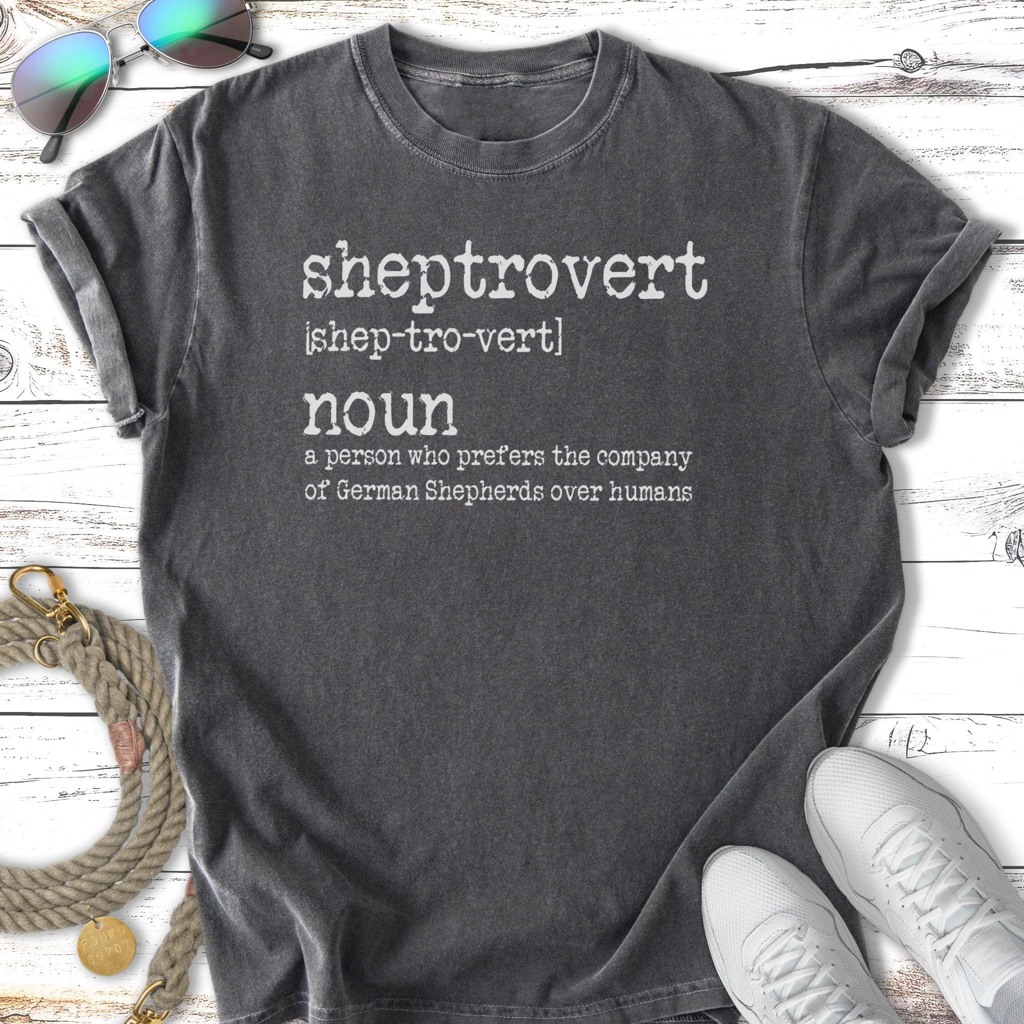 T-shirt with "sheptrovert noun a person who prefers the company of German Shepherds over humans" text.