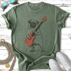 Sketch of a pug playing an orange electric guitar on a green t-shirt.