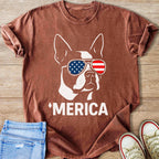 Brown t-shirt graphic of a dog wearing American flag sunglasses and the text 'MERICA.