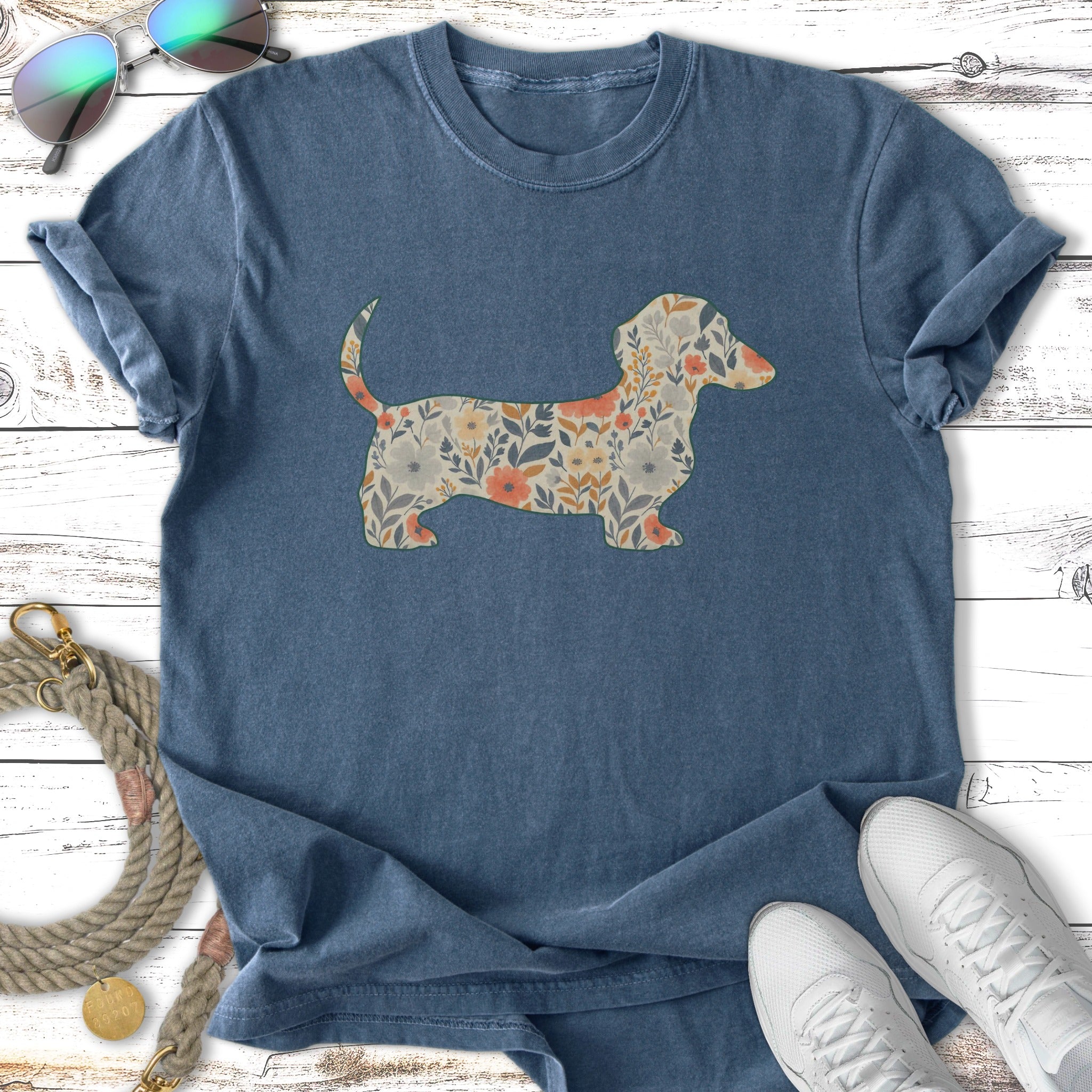 T-shirt with a floral dachshund graphic and sunglasses and sneakers.