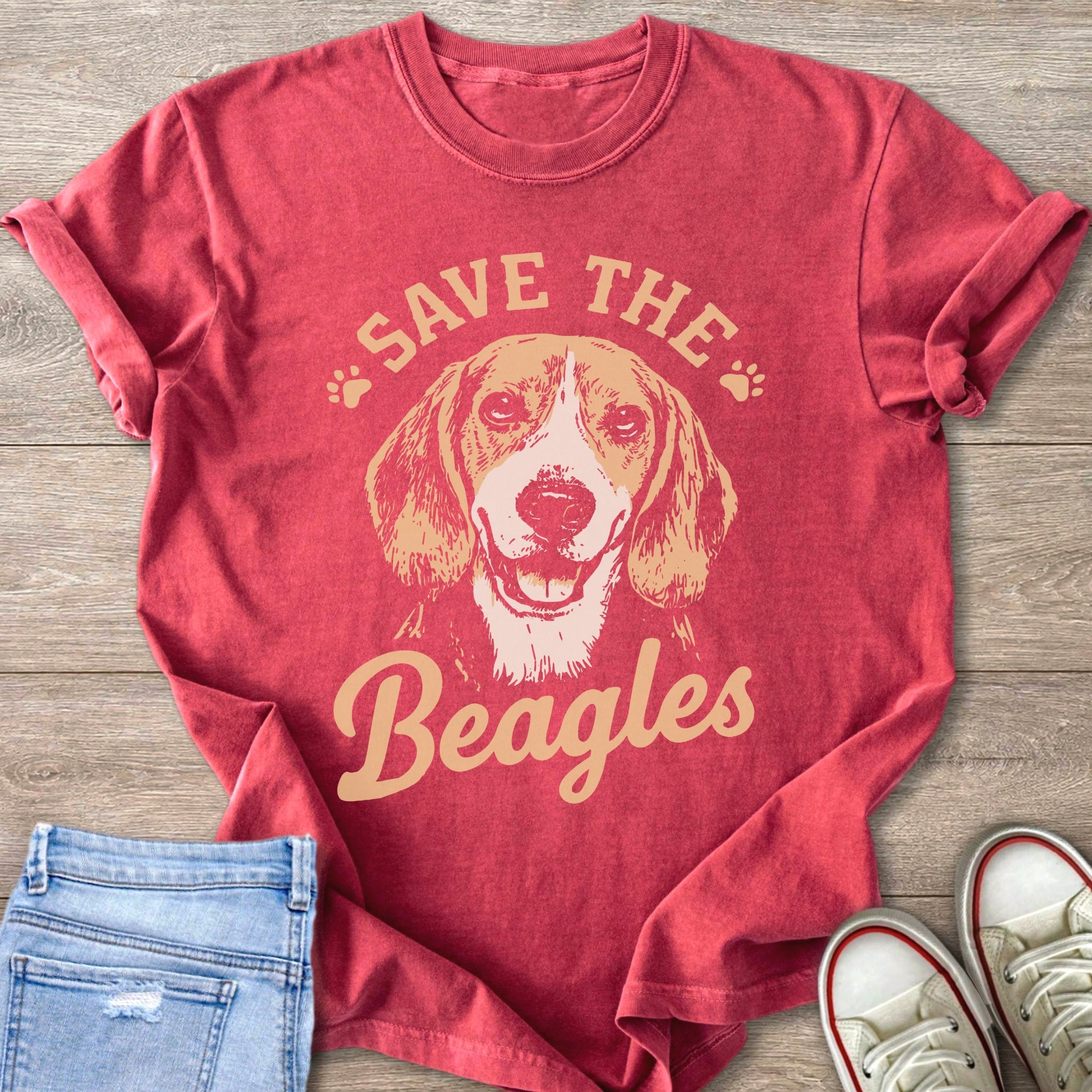 Red t-shirt with a graphic of a beagle and text "Save the Beagles".