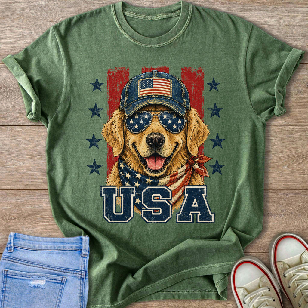 Golden retriever wearing American flag bandana, sunglasses, and baseball cap.