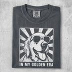Dark gray t-shirt with a white graphic of a golden retriever wearing sunglasses.
