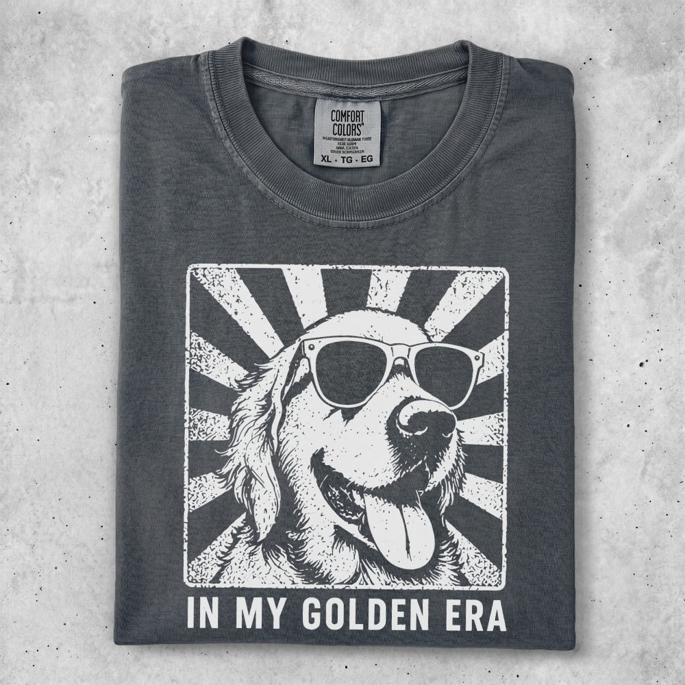 Dark gray t-shirt with a white graphic of a golden retriever wearing sunglasses.
