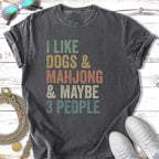 Dark grey t-shirt with "I LIKE DOGS & MAHJONG & MAYBE 3 PEOPLE" text.