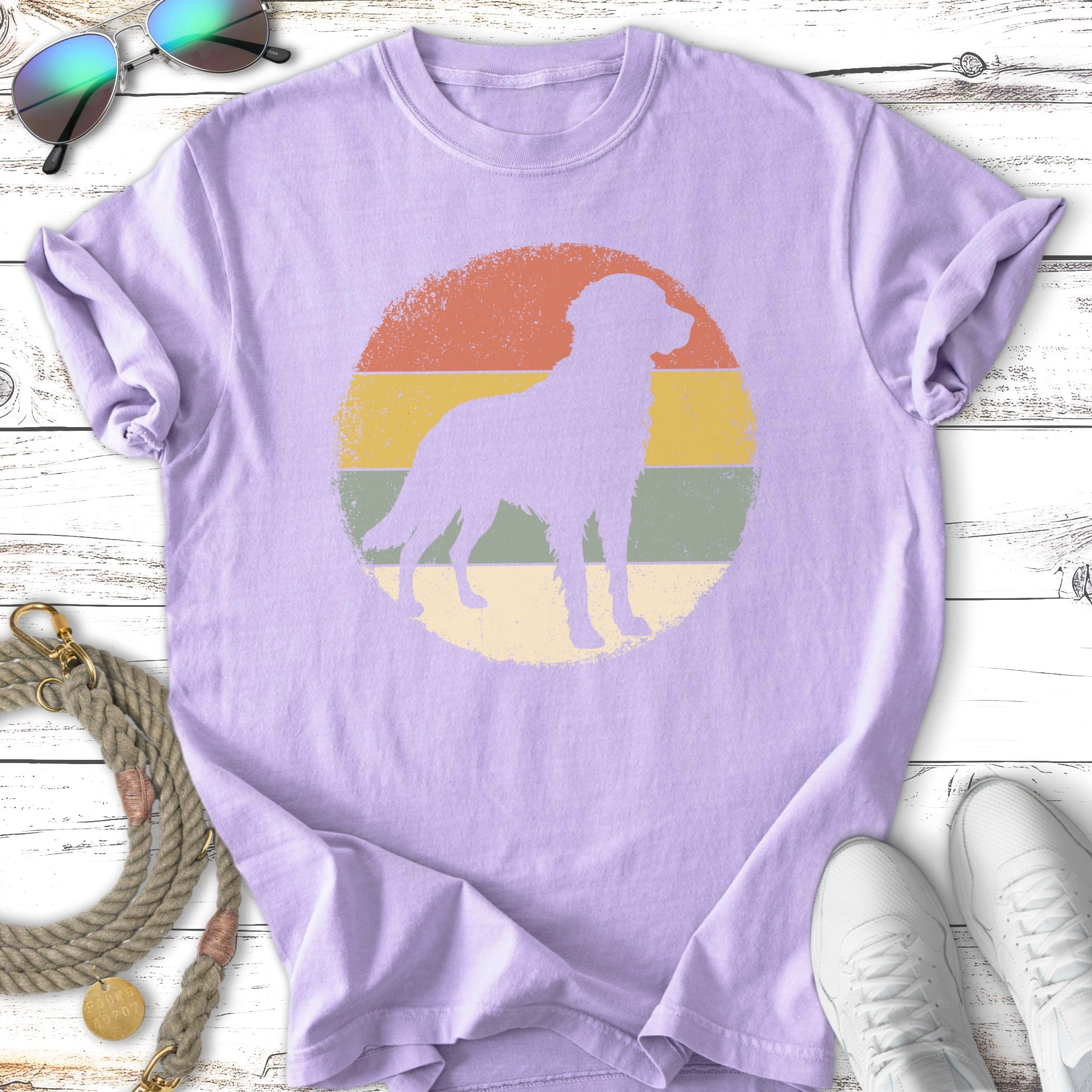 Lavender t-shirt with silhouette of a dog within a distressed circle design.