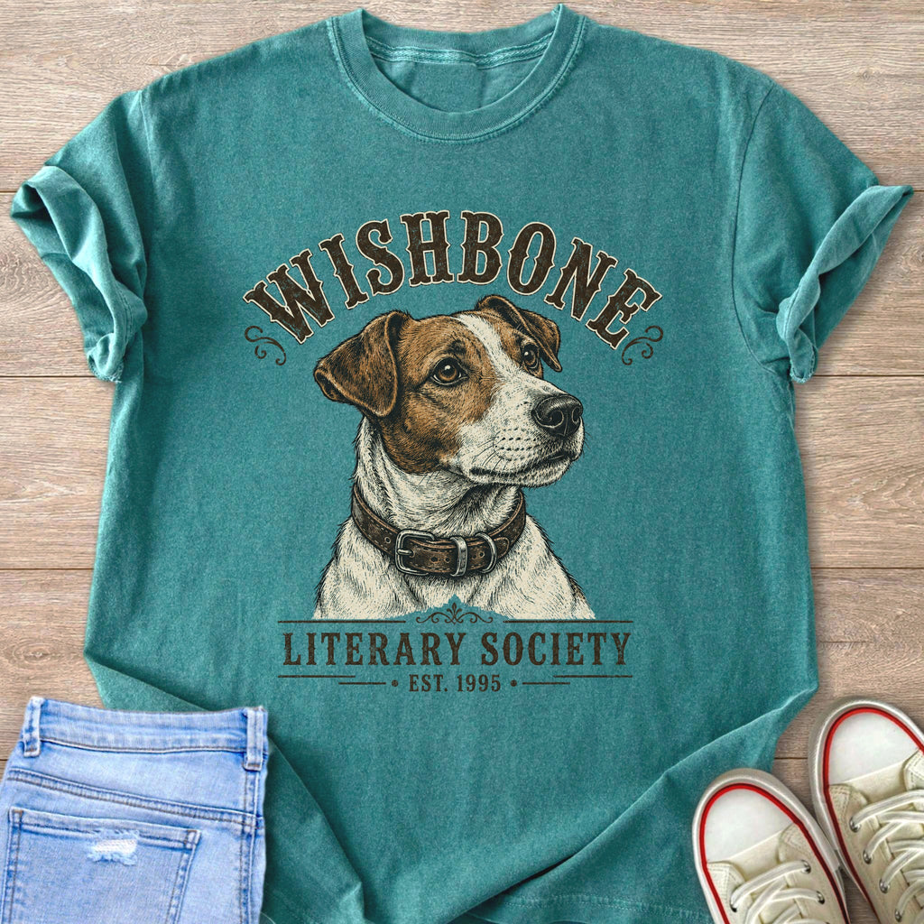 Teal t-shirt with a dog illustration and text "WISHBONE LITERARY SOCIETY EST. 1995".