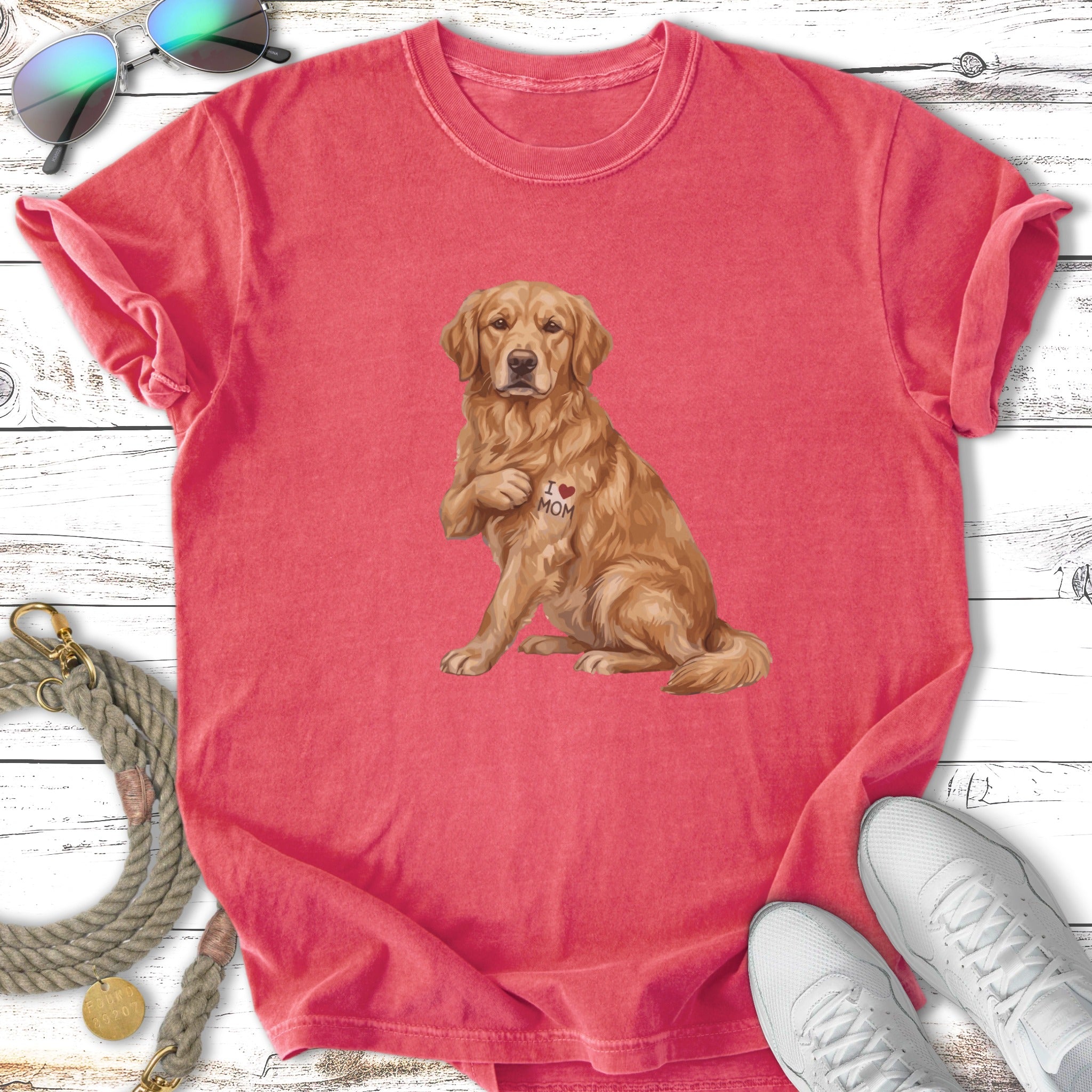Golden Retriever wearing "I Love Mom" temporary tattoo on shirt.