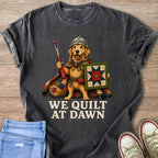 Golden Retriever knight holding a seam ripper and a quilt with text "We Quilt At Dawn".