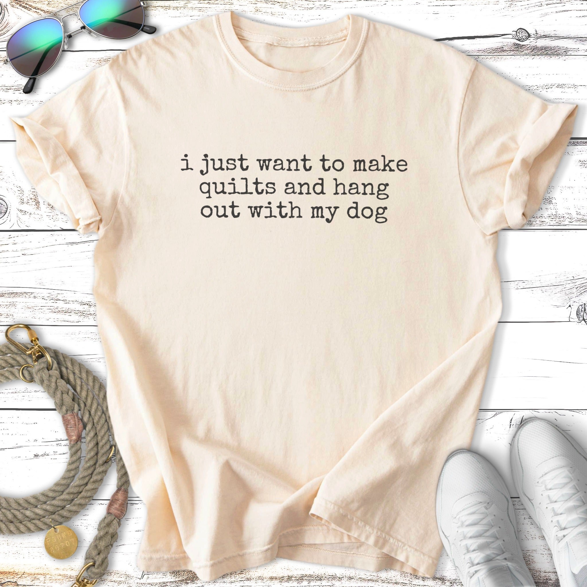 Cream t-shirt with "i just want to make quilts and hang out with my dog" text.