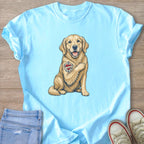 Light blue t-shirt with graphic of golden retriever with "I Love Mom" tattoo.