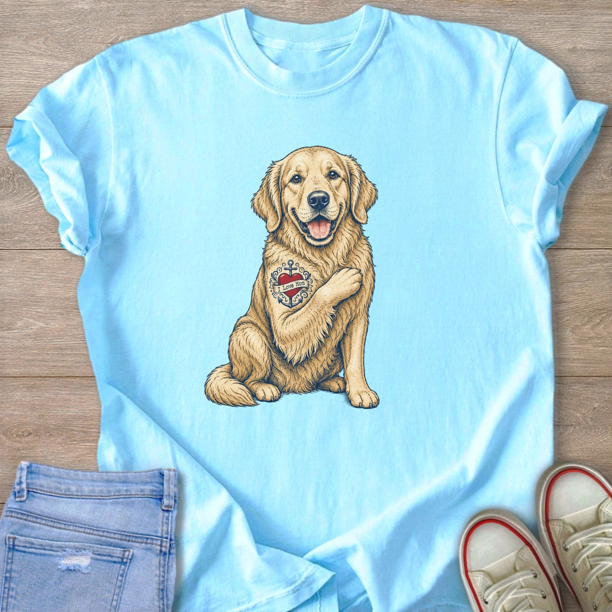 Light blue t-shirt with graphic of golden retriever with "I Love Mom" tattoo.