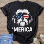 Black t-shirt with white dog graphic wearing American flag sunglasses and "'MERICA" text.