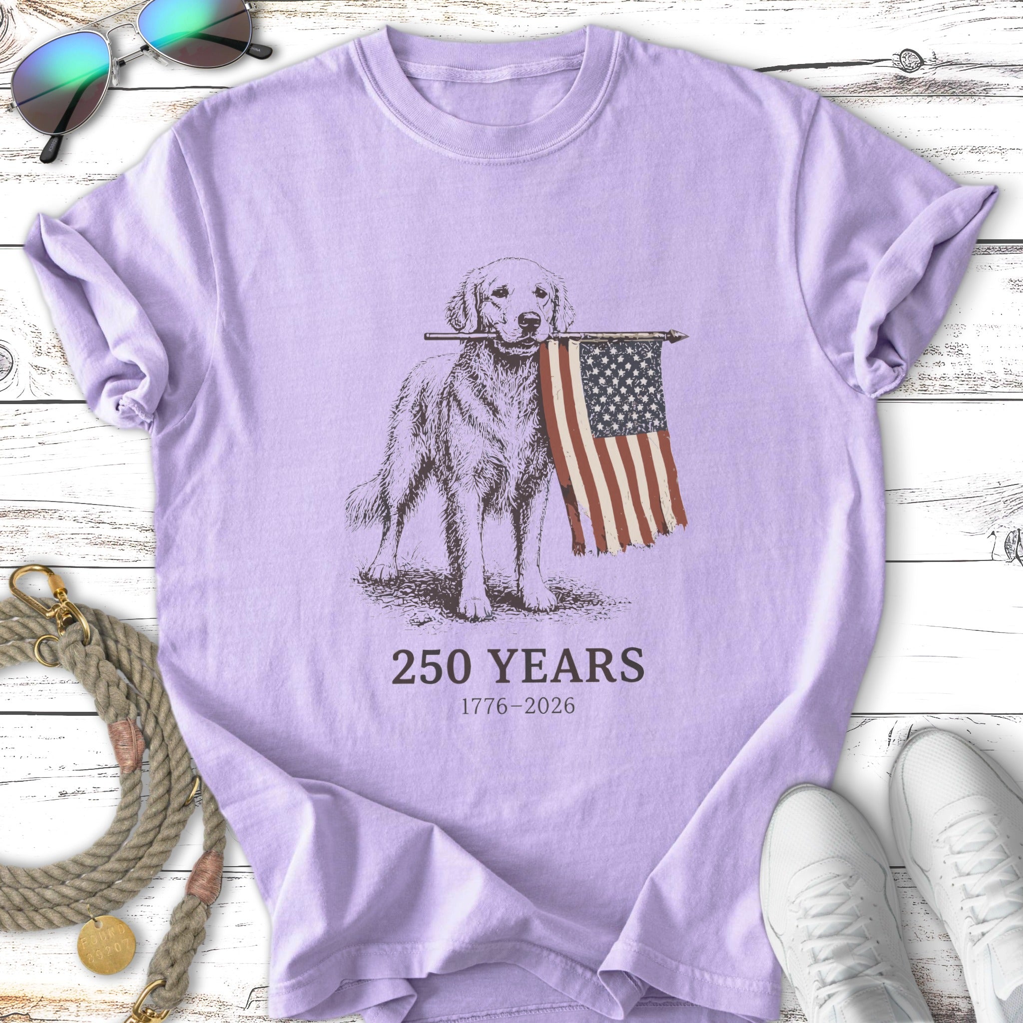 Golden retriever holds American flag, "250 YEARS 1776-2026" text.