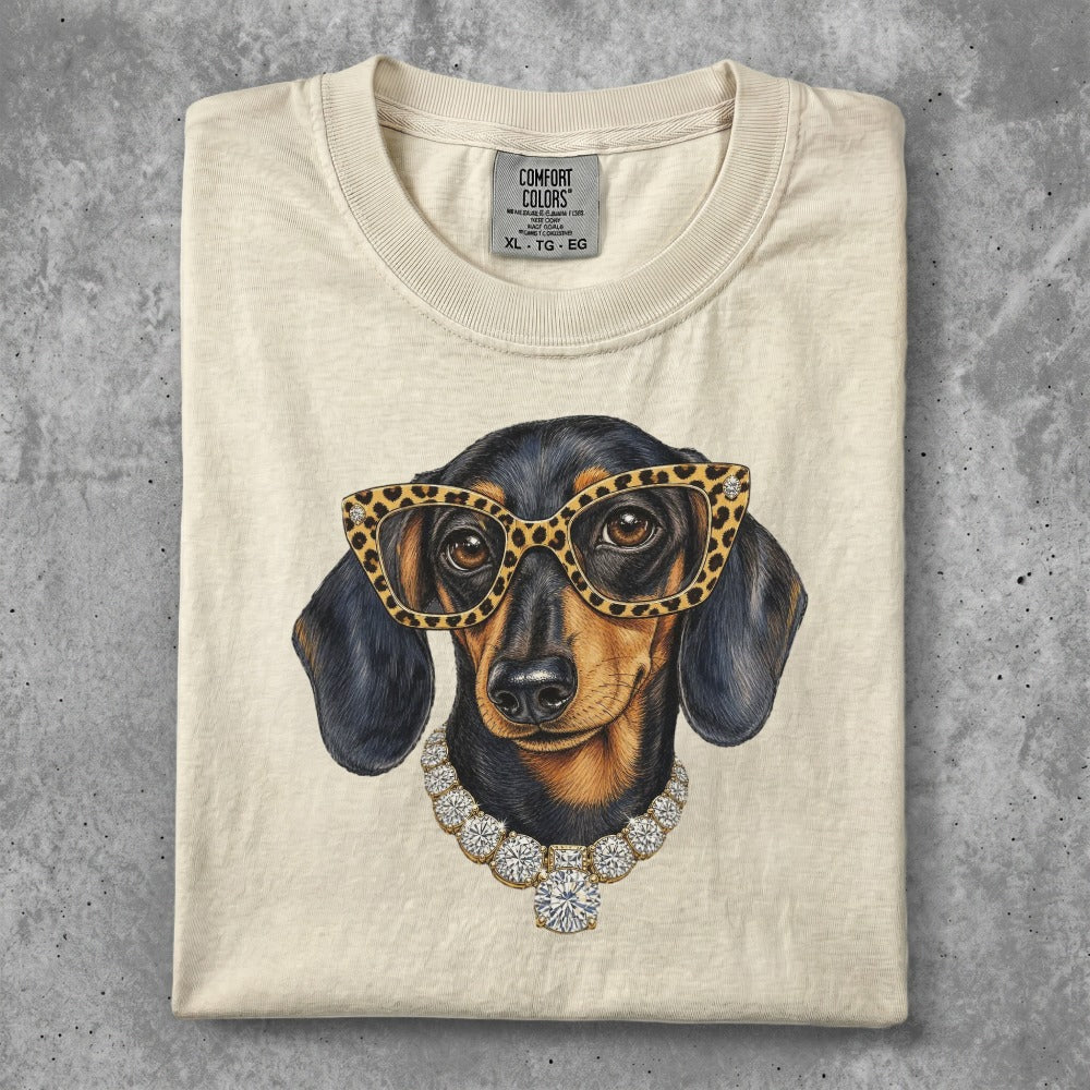 Dachshund wearing leopard print glasses and diamond necklace.