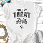 White t-shirt with "Certified Treat Dealer" and a paw print graphic.