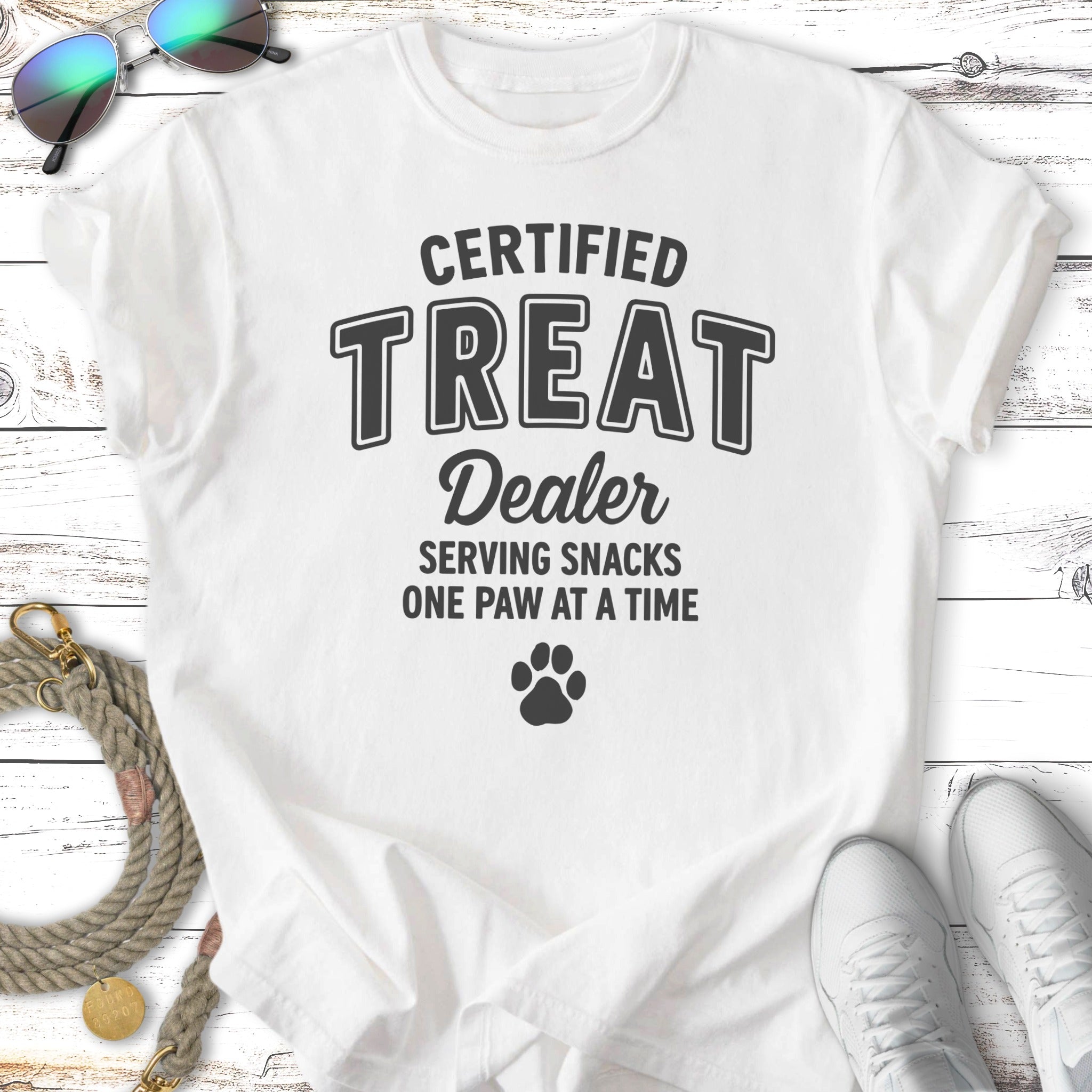 White t-shirt with "Certified Treat Dealer" and a paw print graphic.