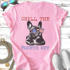 French bulldog wearing American flag sunglasses on pink t-shirt with "Chill The Fourth Out" text.