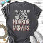 Dark t-shirt with text "I JUST WANT TO PET DOGS AND WATCH HORROR MOVIES".