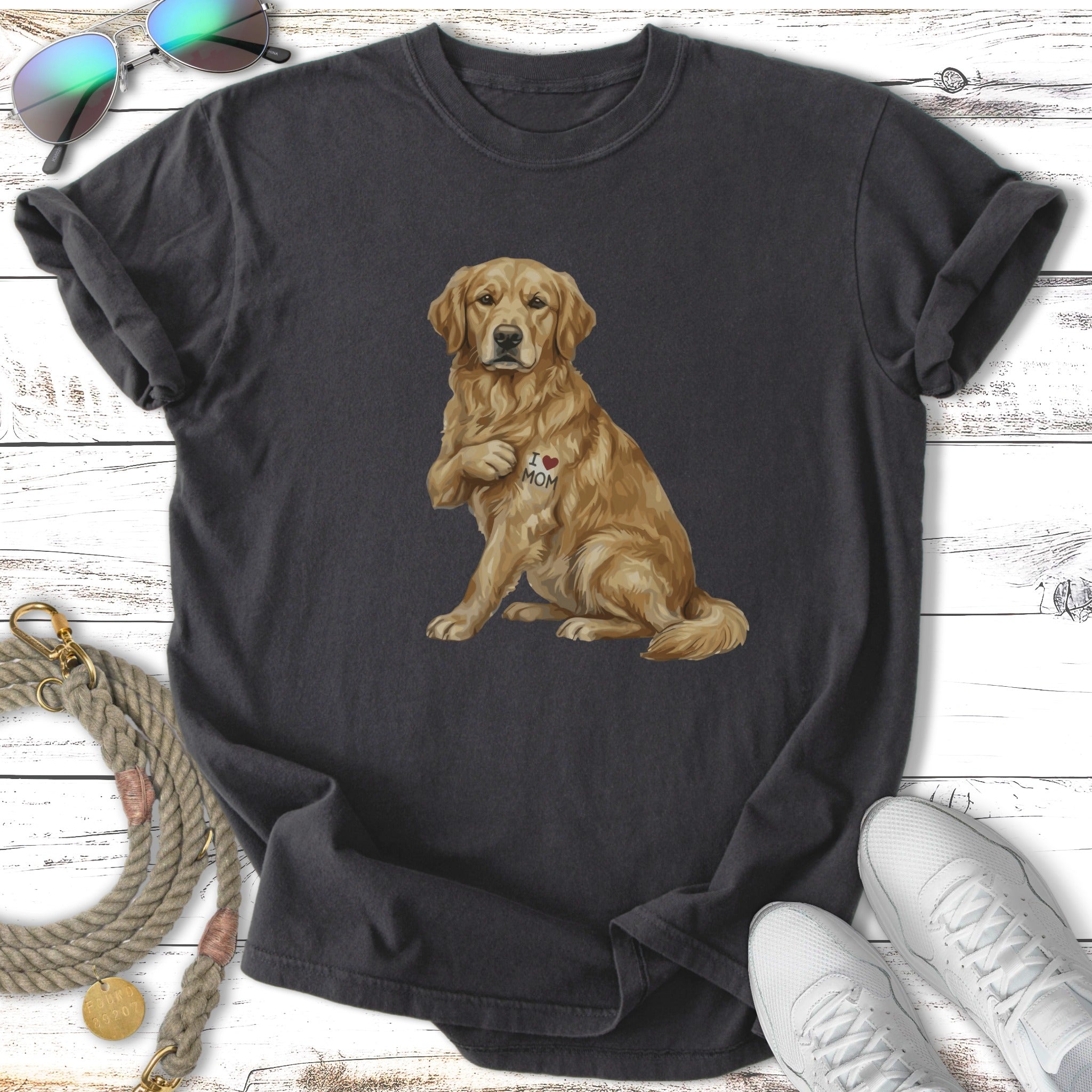 Golden retriever wearing a t-shirt with an "I love Mom" heart tattoo.