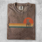 Brown t-shirt with a French bulldog silhouette against a retro sunset graphic.