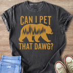 Dark gray t-shirt with gold text "CAN I PET THAT DAWG?" above a bear silhouette filled with trees.