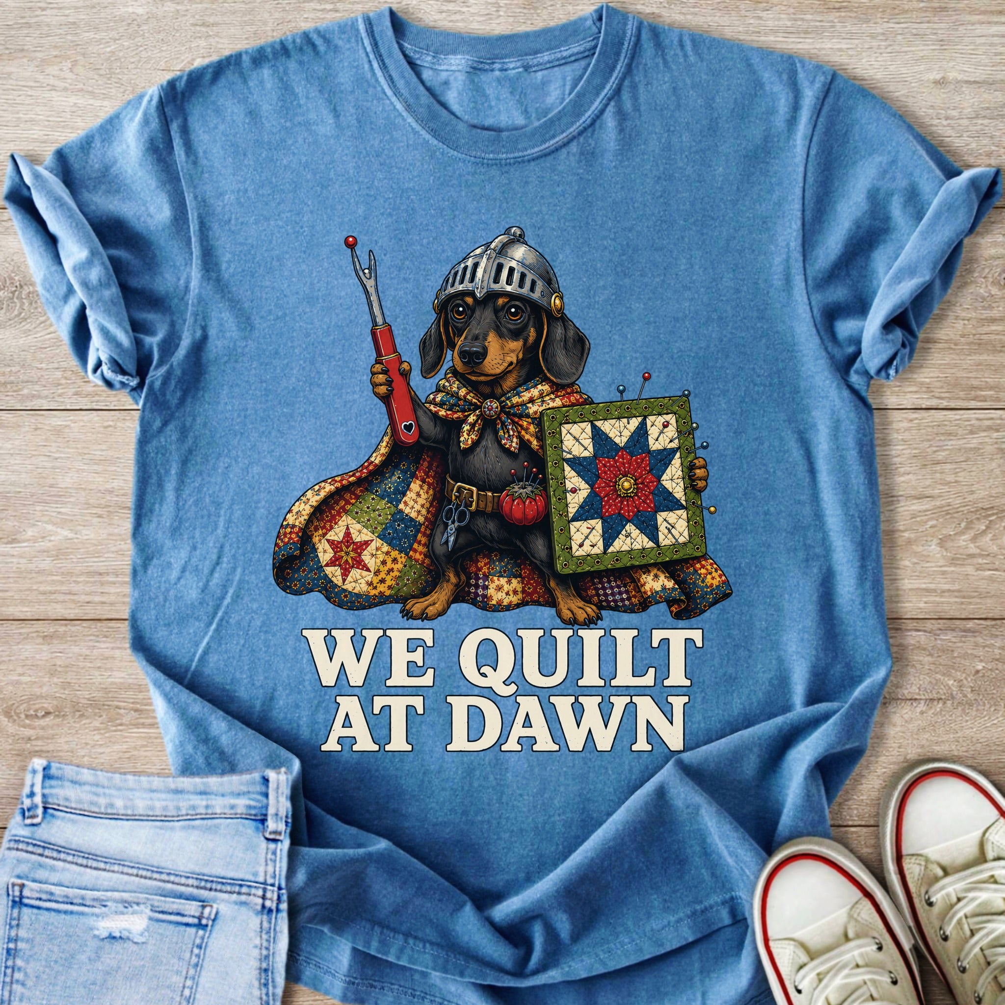 Dachshund in knight's armor holding quilting tools and a quilt with text "We Quilt At Dawn".