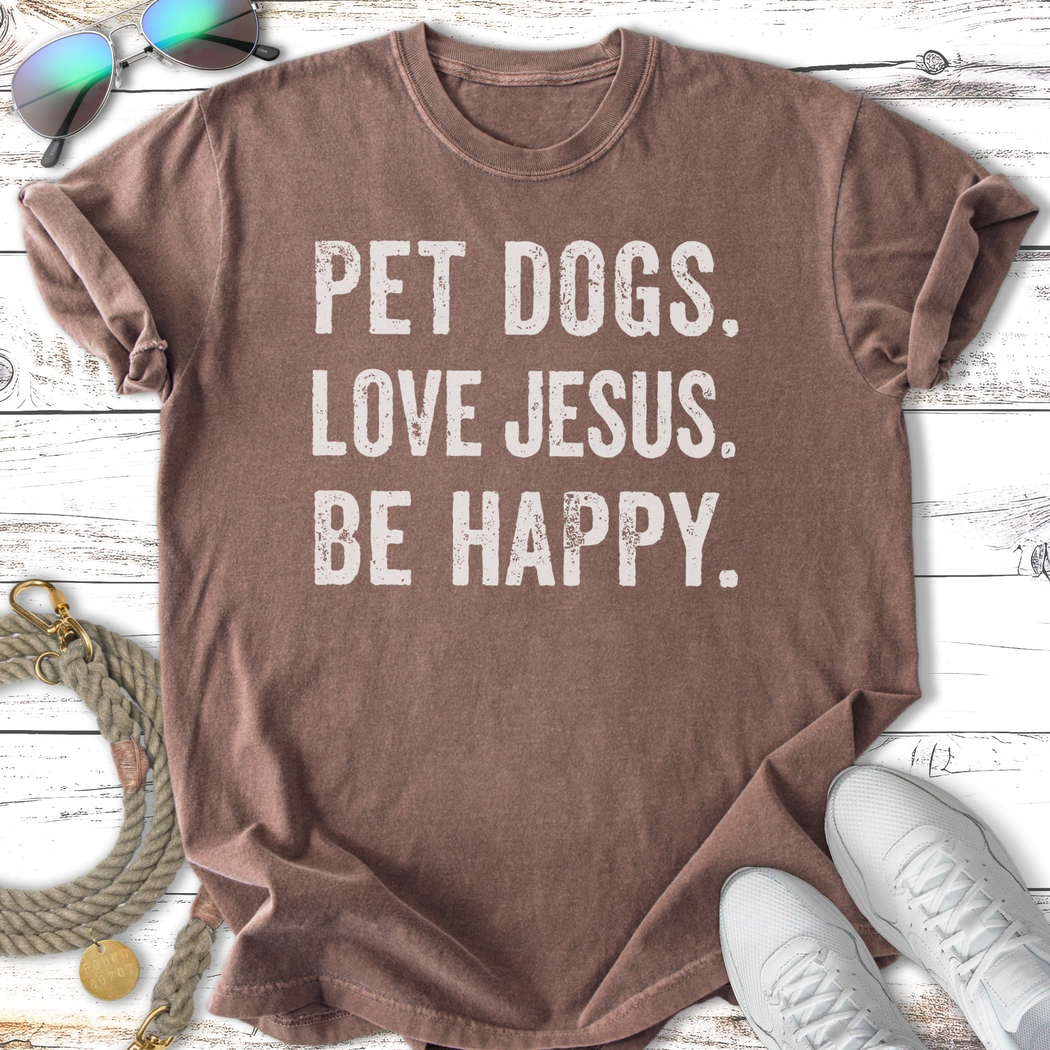 Brown t-shirt with white text "PET DOGS. LOVE JESUS. BE HAPPY."